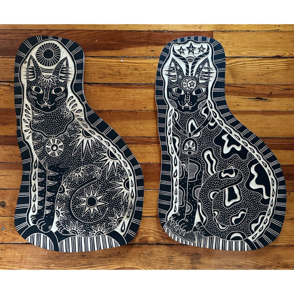 Cat woodcarvings created by Bryn Perrott